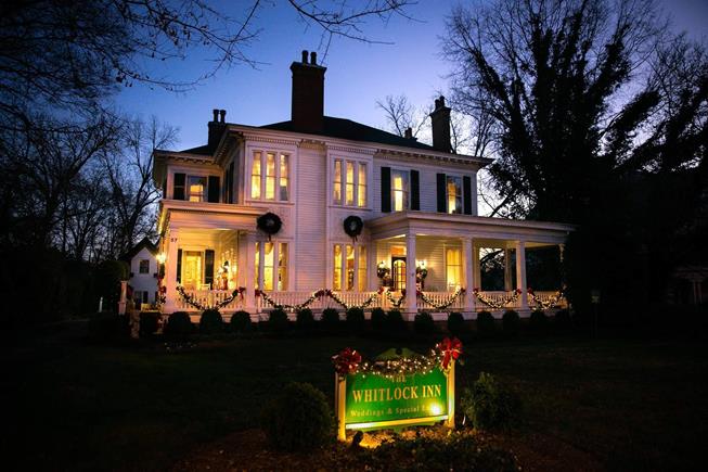 An image of the Historic Whitlock Inn in Marietta, GA at night time.